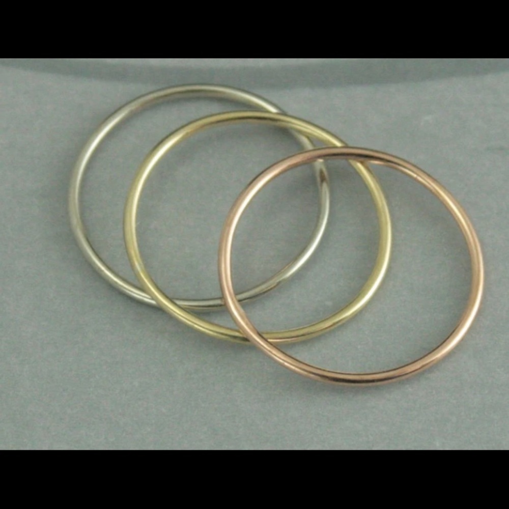 Rings - 10K White Gold, 10K Yellow Gold, and 10K Rose Gold. 1.46 grams   
Size 6